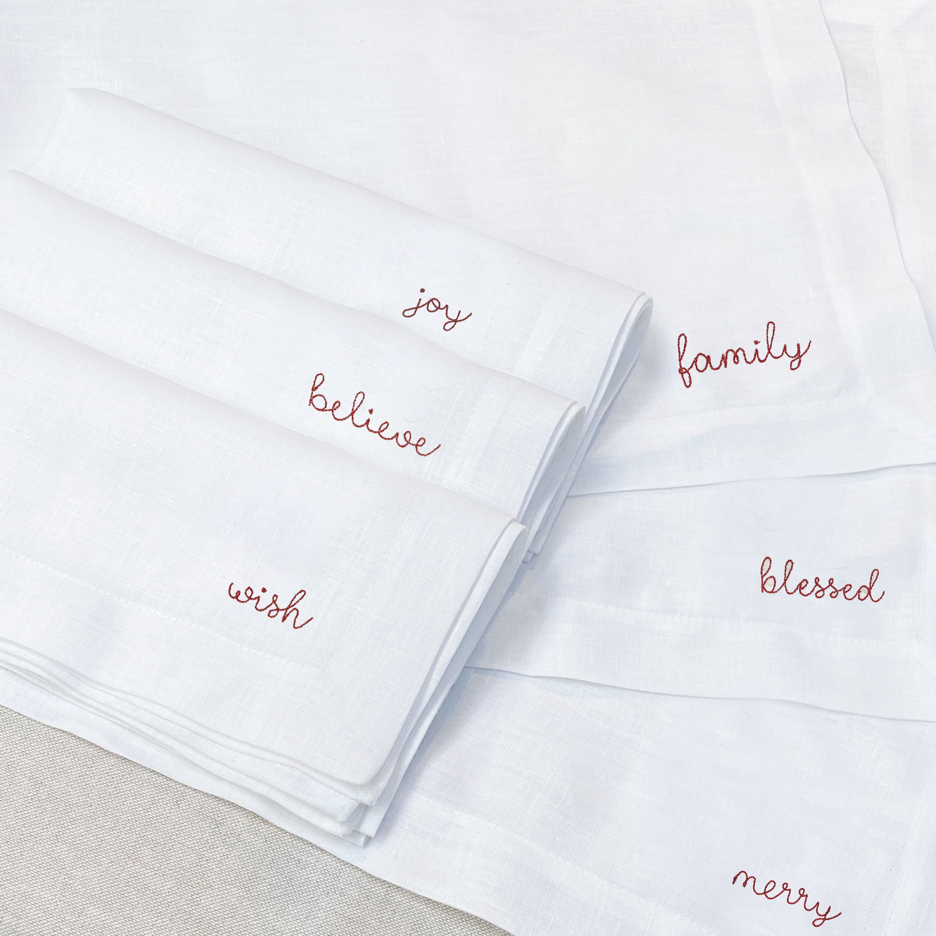 individual con servilleta de lino bordado palabras navidad - Barioles Casa